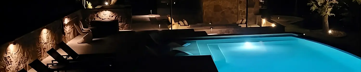pool-landscape-lighting-night-austin-tx-delta-outdoor-lighting Delta Outdoor Lighting pool, path, and stone accent wall lighting on a Central Texas patio near Austin, TX